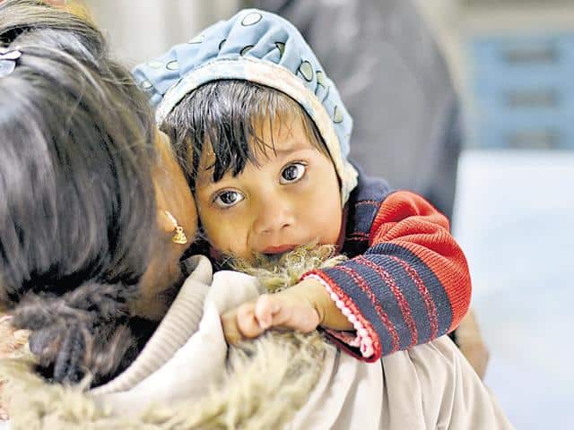 Woman pushes 2-yr daughter in front of moving bus