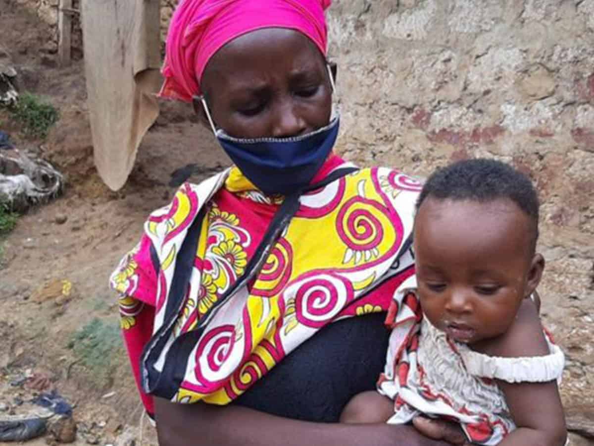 Mother pretends to boil stones as food for her starving children