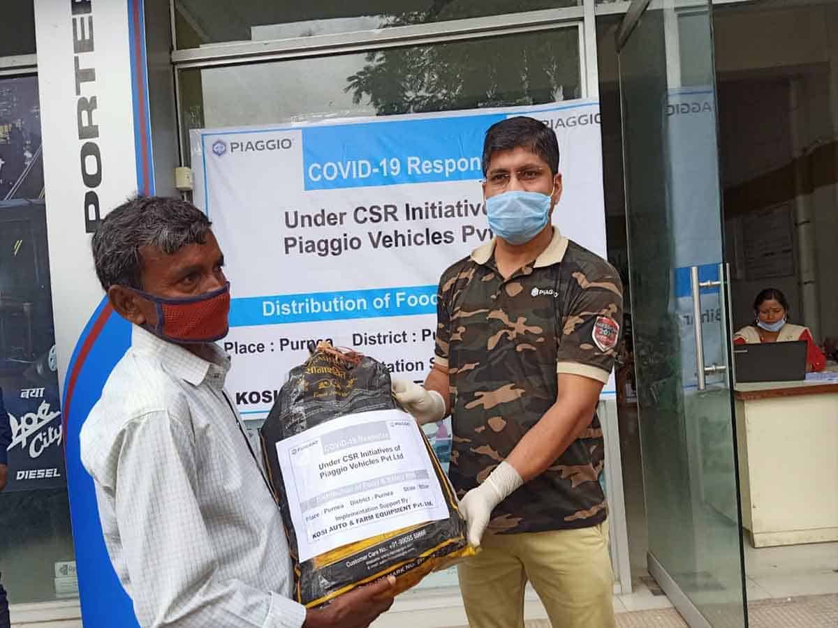Piaggio donates 11000 + ration Kits to auto drivers