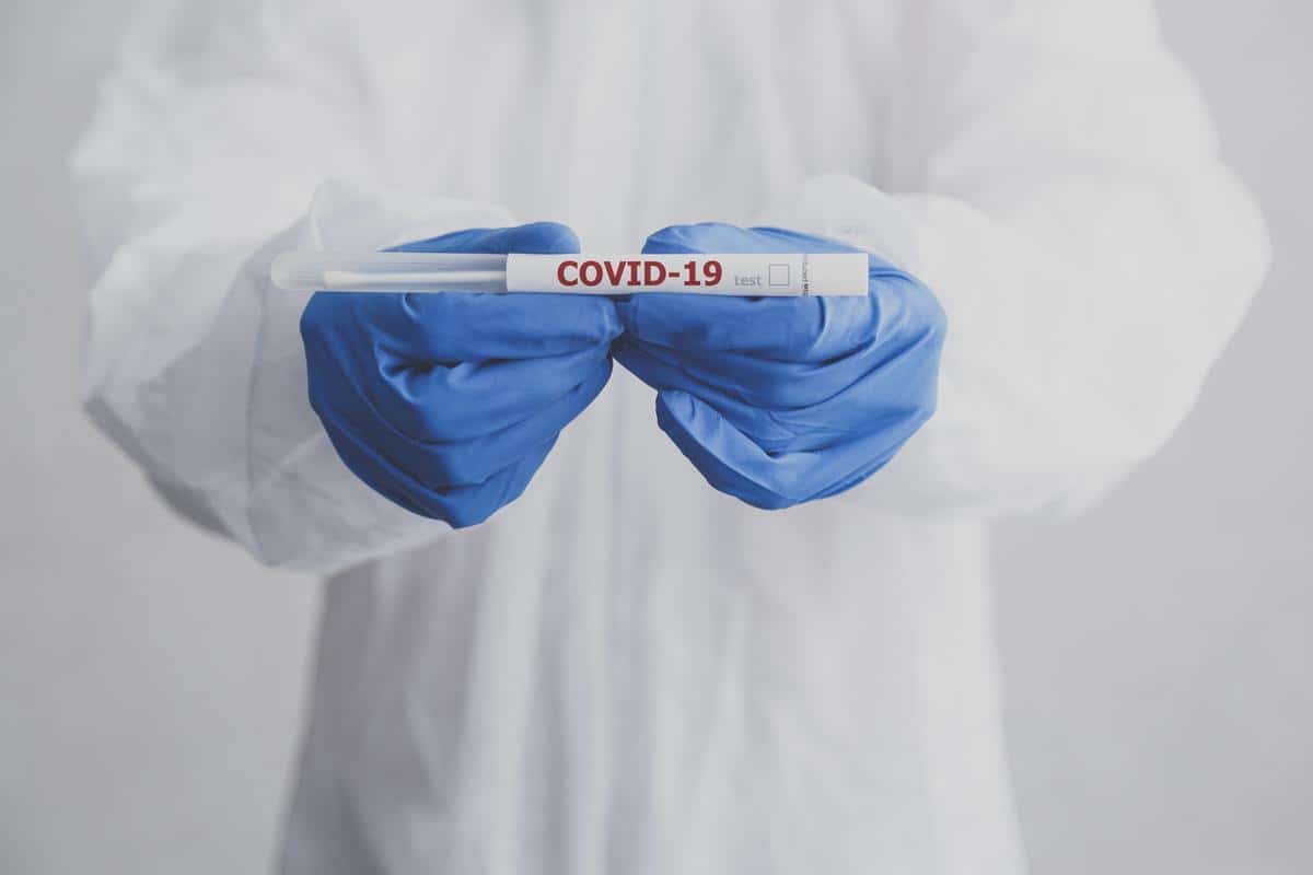 Laboratory technician hold coronavirus test tube for COVID-19 test