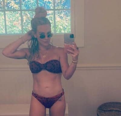 Hilary Duff flaunts toned abs