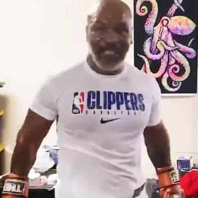 Tyson using electric muscle stimulation to treat pain in training camp
