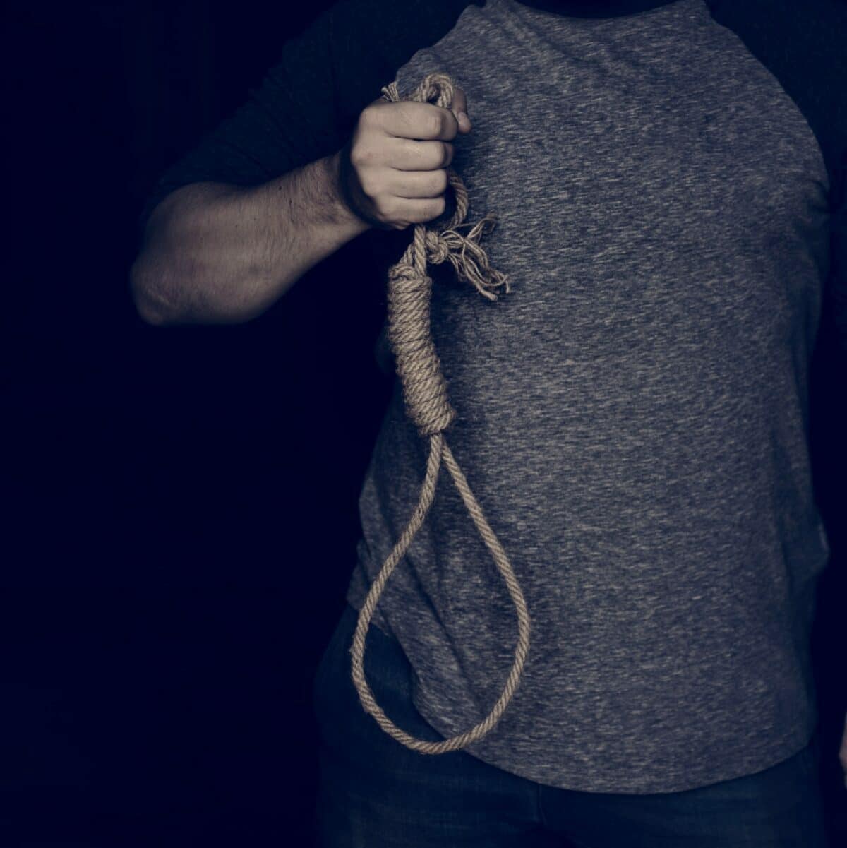 Hand holding loop rob with black background