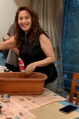 Madhuri's family pitches in to help out with her kitchen garden
