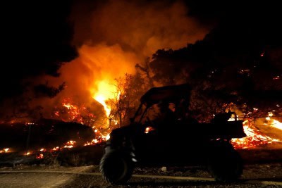 Over 13,800 firefighters battle 21 major wildfires in California