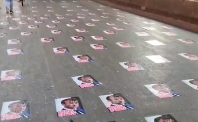 Police remove posters of Macron pasted on Mumbai road