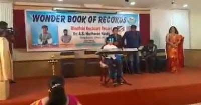 13-year-old sets record playing keyboard with a blindfold