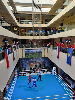 A stunning chandelier adds beauty to a makeshift boxing ring