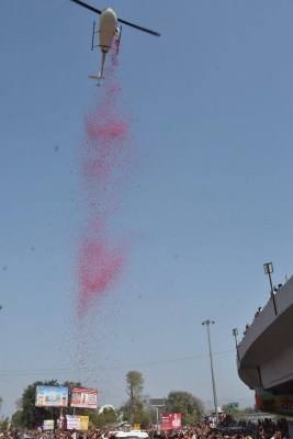 Sadhus showered with flowers from helicopter during Shahi Snan