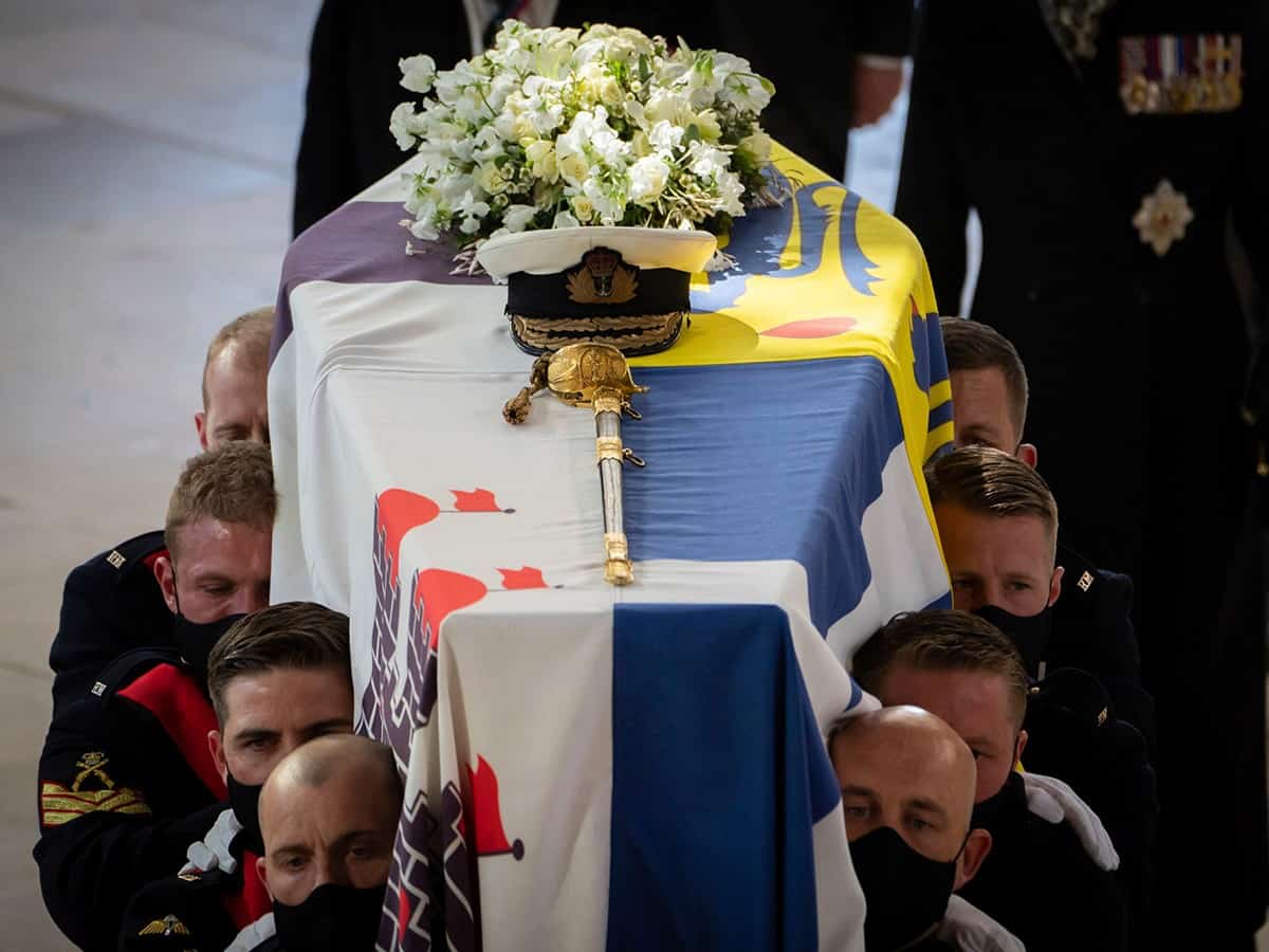 Prince Philip is laid to rest as somber queen sits alone