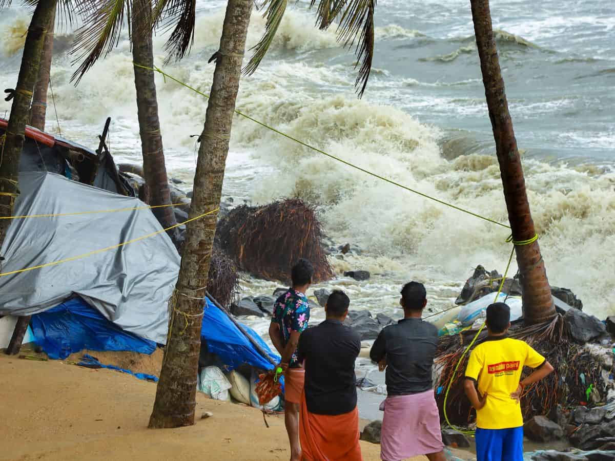 Kozhikode: Locals gather near the debris of a house on the beach that was damaged by the rough sea during the ongoing monsoon season, in Kozhikode, Friday,